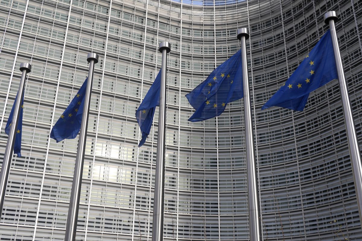 Five flags in front of European Commission building