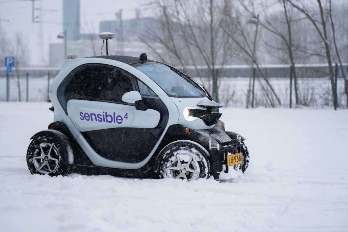 A small car driving on snow